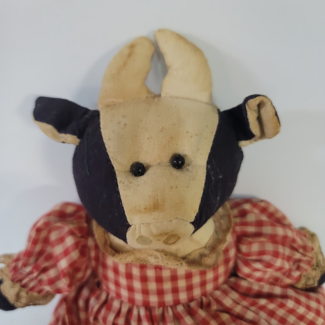 Rustic Cow in a dress gingham needs a bath