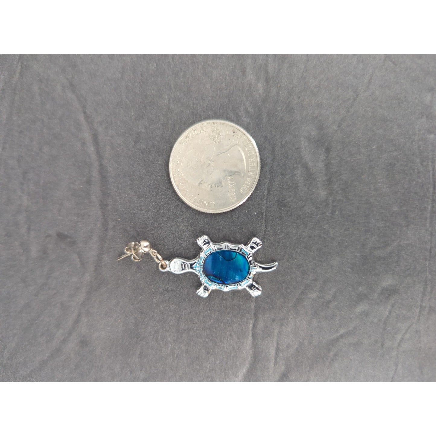 Vintage silver abalone turtle pendant features a detailed, polished shell design