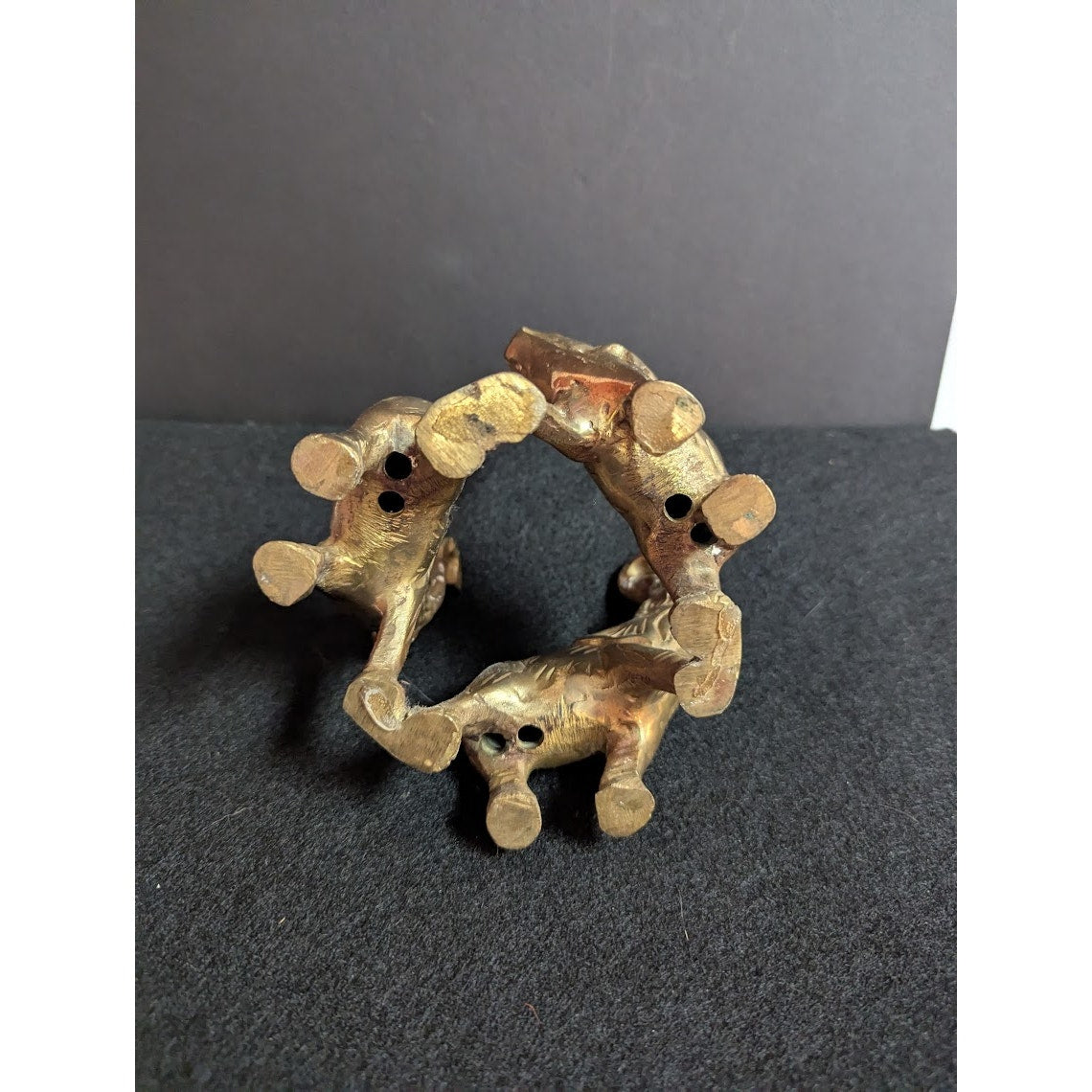 Small vintage bronze ring of 3 elephants trunks raised all attached
