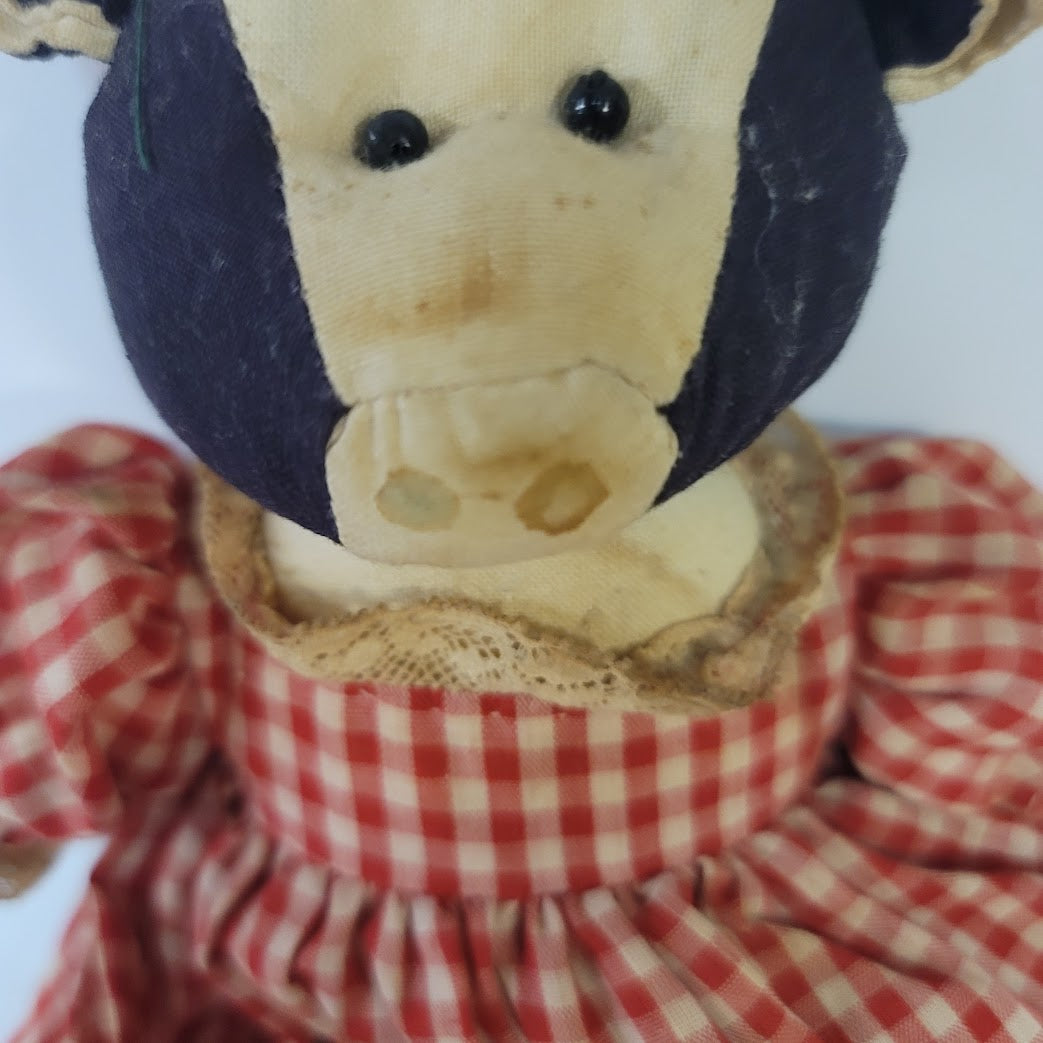 Rustic Cow in a dress gingham needs a bath