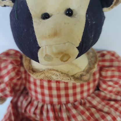 Rustic Cow in a dress gingham needs a bath