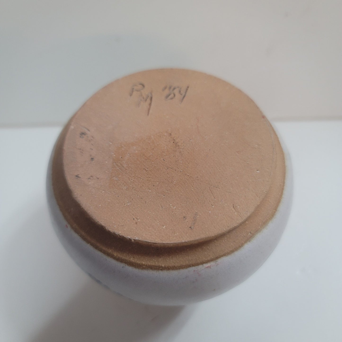 Round spherical vase art pottery small signed RY 1984 blue cream earthtones