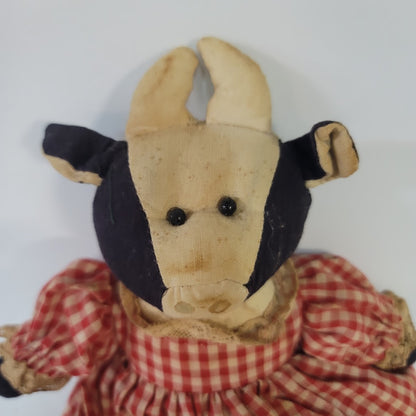 Rustic Cow in a dress gingham needs a bath