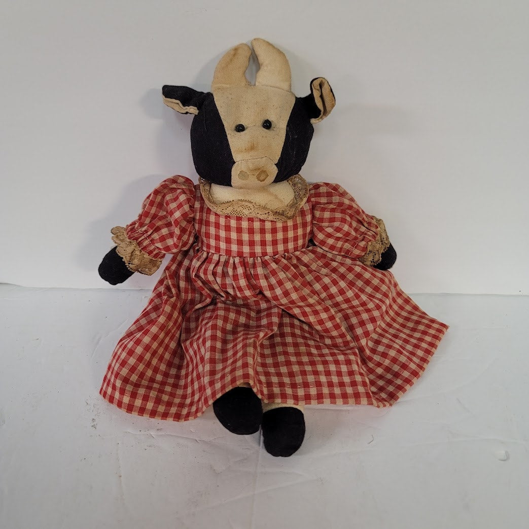 Rustic Cow in a dress gingham needs a bath