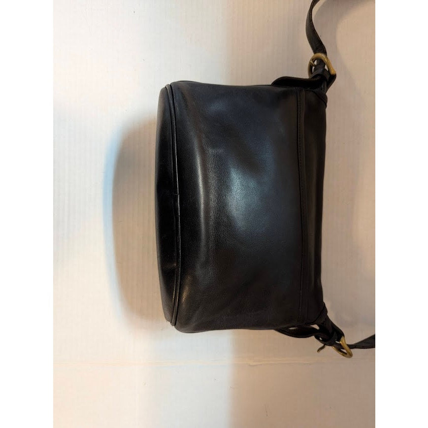 Coach Fletcher bag model 4150 crafted black leather saddle-bucket silhouette