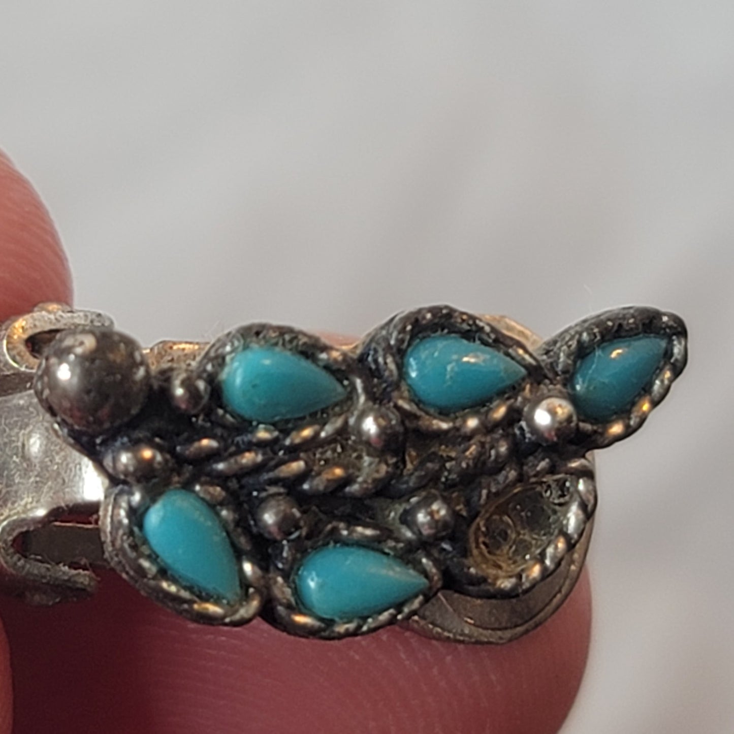 Faux turquoise  silvertone sweater double clip missing one stone