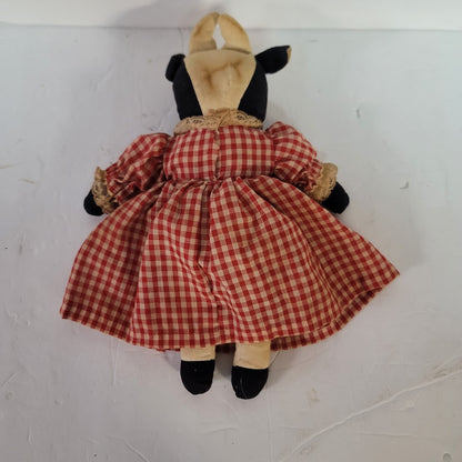 Rustic Cow in a dress gingham needs a bath