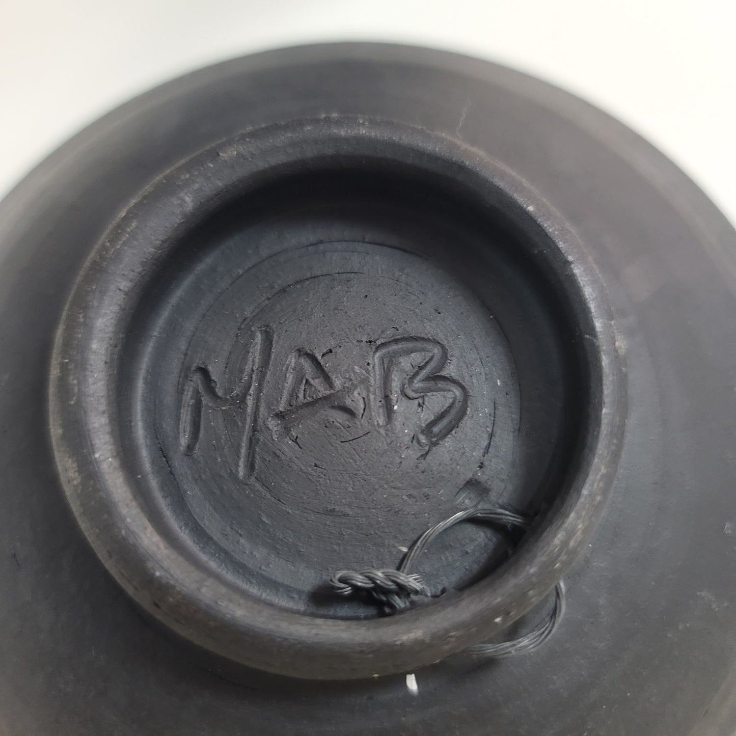Art pottery female nude red surrounded by stars signed MAB wall decor bowl red