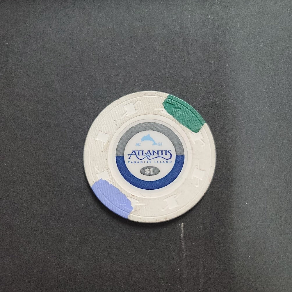 Casino Chip ATLANTIS PARADISE ISLAND $1 gaming white blue green dolphin