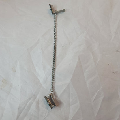 Faux turquoise  silvertone sweater double clip missing one stone