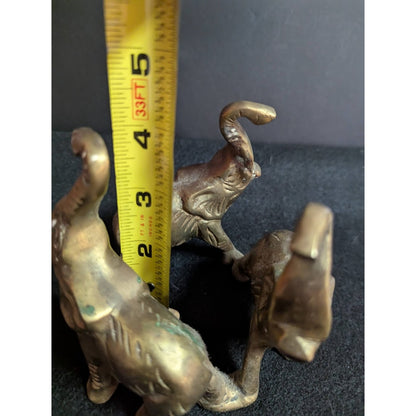 Small vintage bronze ring of 3 elephants trunks raised all attached
