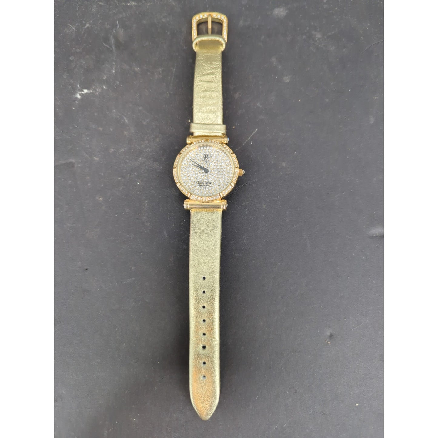 Vtg. Victoria Wieck Beverly Hills Gold Tone Crystal Pave Watch Gold Leather Band