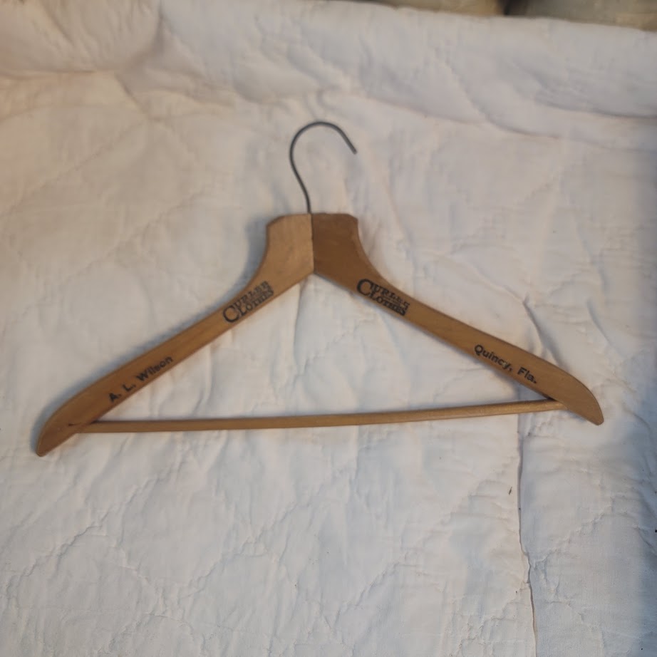 A.L. Wilson Adversting wood clothes hanger Curlee Clothes Quincy, Florida