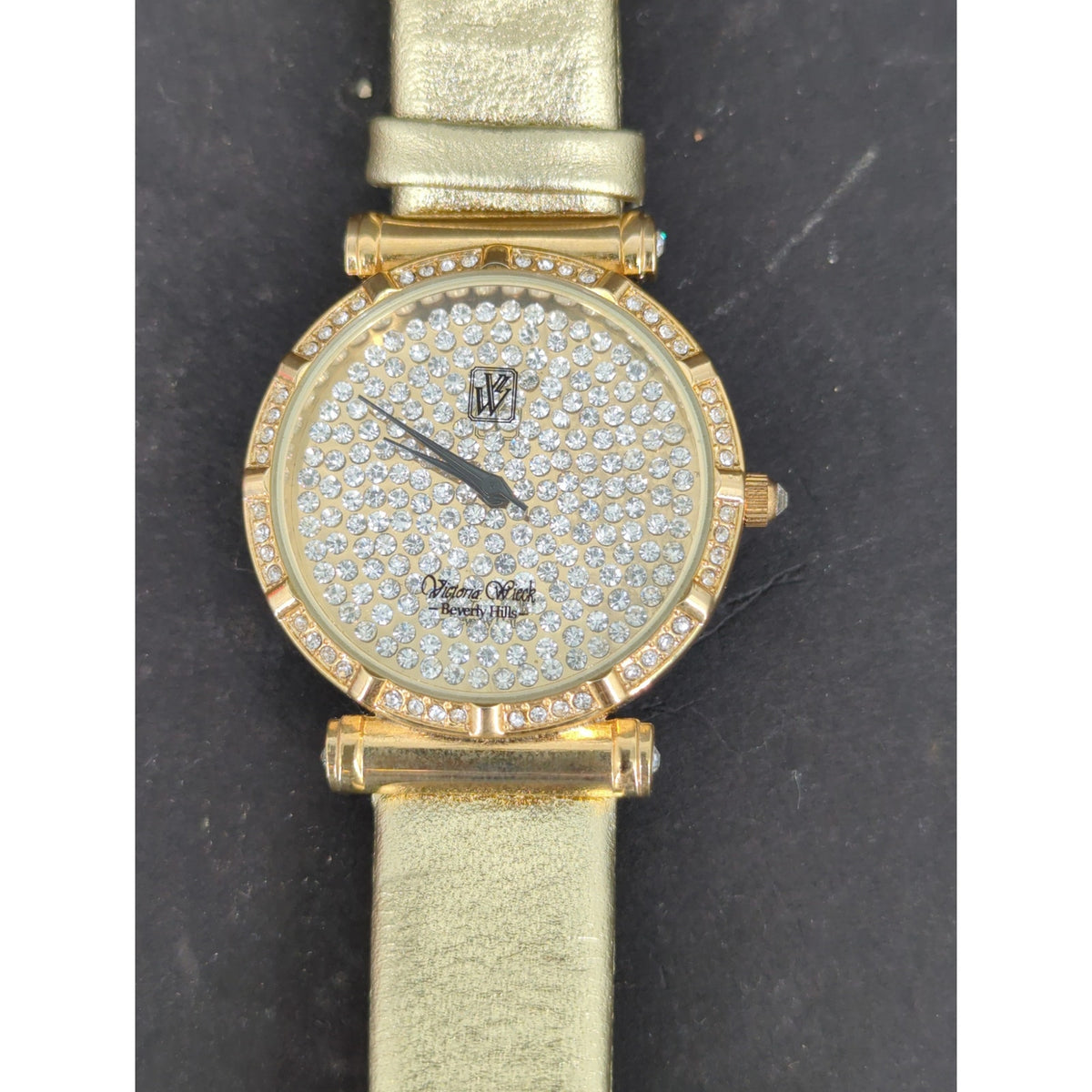 Vtg. Victoria Wieck Beverly Hills Gold Tone Crystal Pave Watch Gold Leather Band