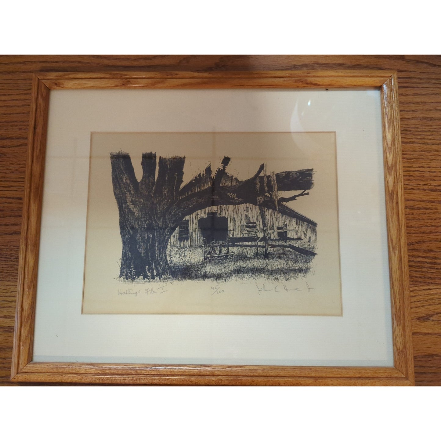 John E. Helms Jr. titled Hastings Fla. I #45/200 Oak Frame Glass Lit