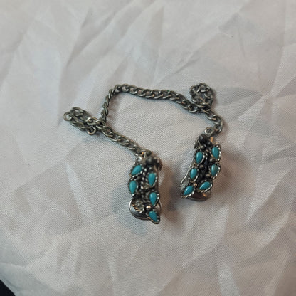 Faux turquoise  silvertone sweater double clip missing one stone
