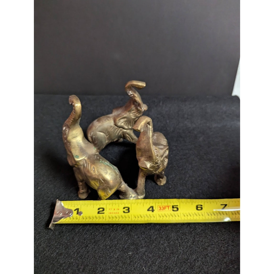 Small vintage bronze ring of 3 elephants trunks raised all attached