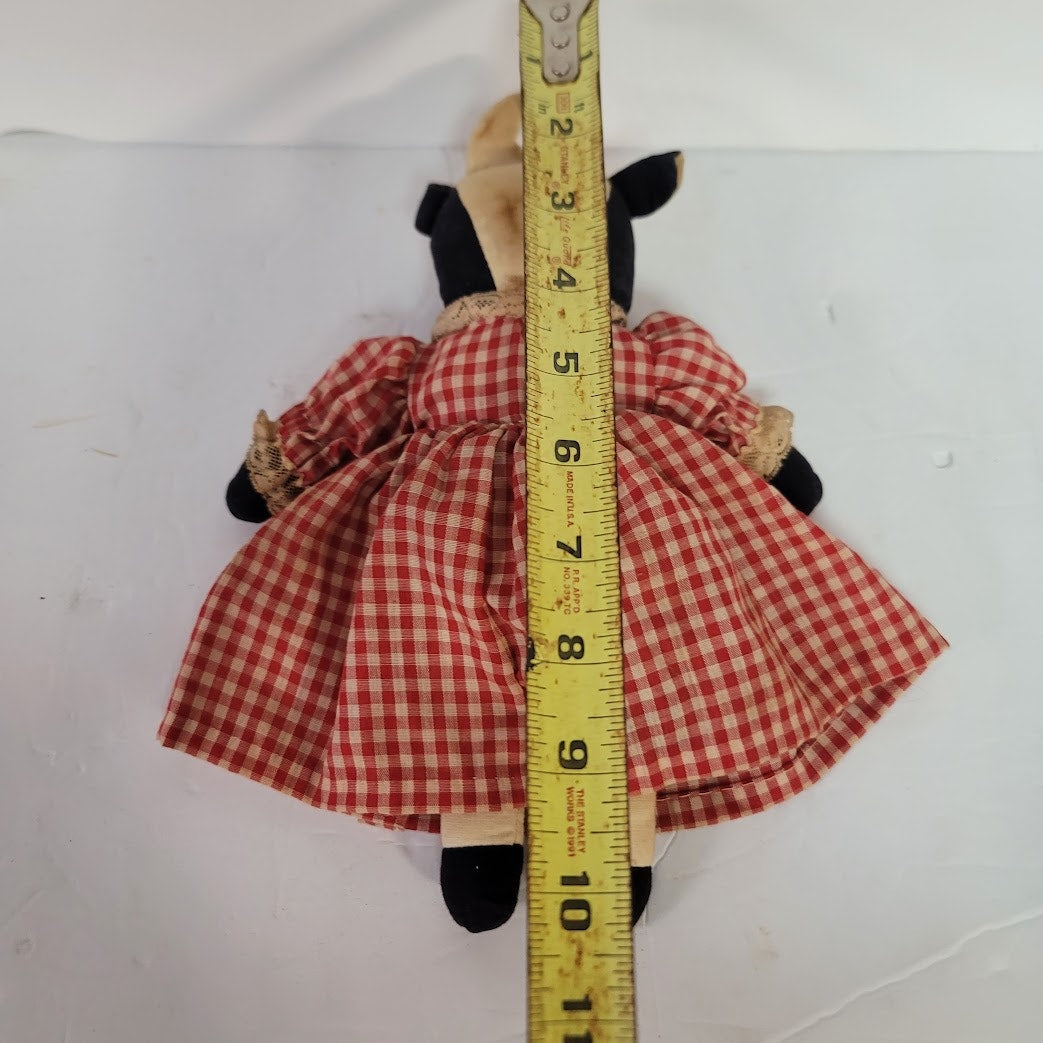 Rustic Cow in a dress gingham needs a bath
