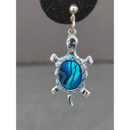 Vintage silver abalone turtle pendant features a detailed, polished shell design
