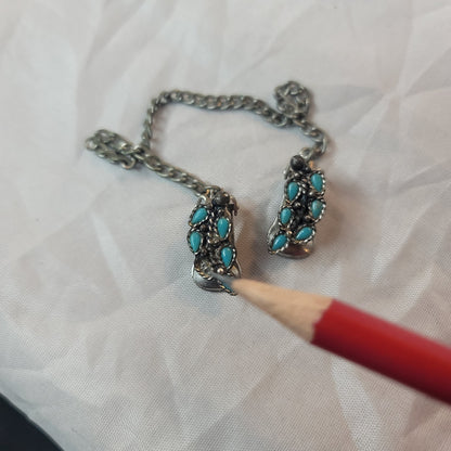 Faux turquoise  silvertone sweater double clip missing one stone
