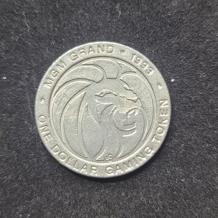 1993 MGM Grand Dina one dollar gaming token Metal Las Vegas NVD
