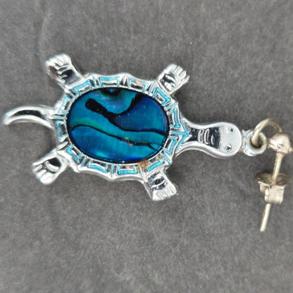 Vintage silver abalone turtle pendant features a detailed, polished shell design