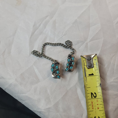 Faux turquoise  silvertone sweater double clip missing one stone