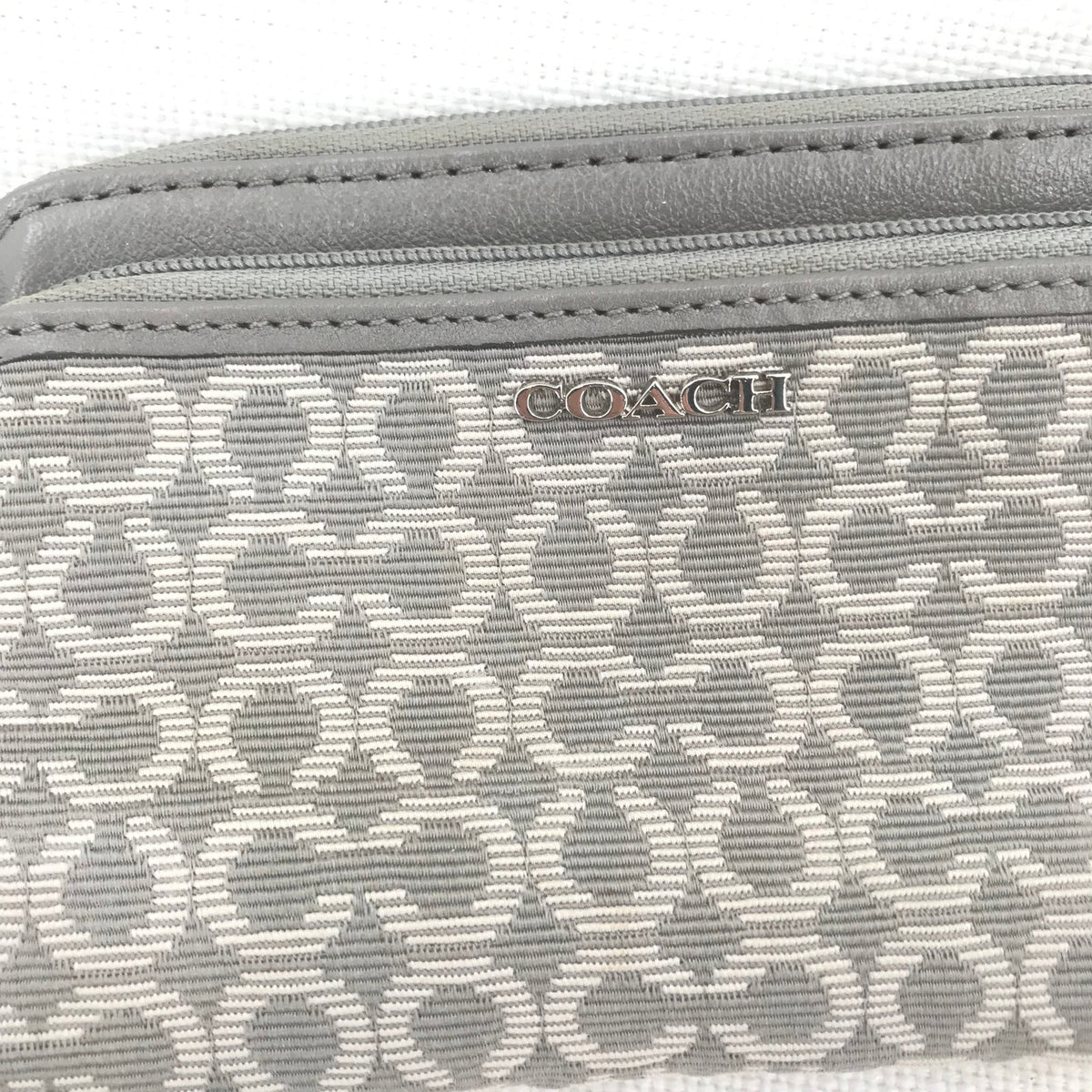 CoachCoach Madison Dotted Op Art Signature Jacquard Wristlet in gray and silver