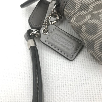CoachCoach Madison Dotted Op Art Signature Jacquard Wristlet in gray and silver