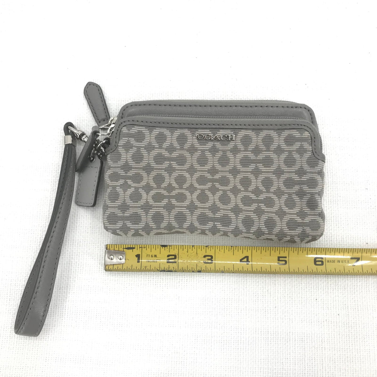 CoachCoach Madison Dotted Op Art Signature Jacquard Wristlet in gray and silver