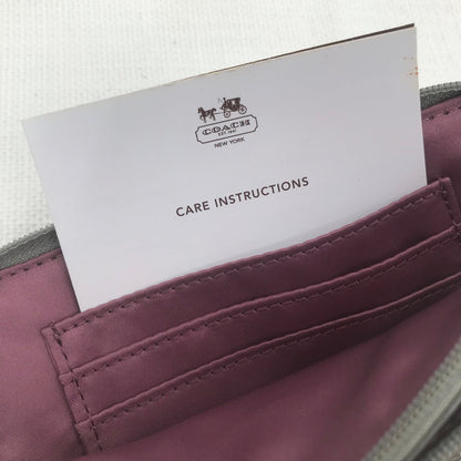 CoachCoach Madison Dotted Op Art Signature Jacquard Wristlet in gray and silver