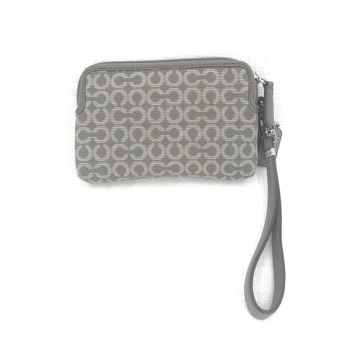 CoachCoach Madison Dotted Op Art Signature Jacquard Wristlet in gray and silver
